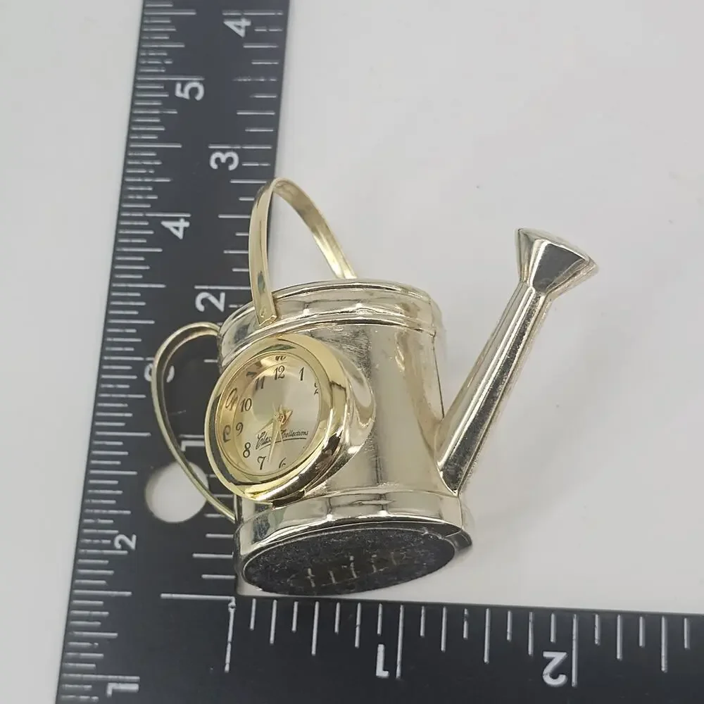 2 SMALL QUARTZ CLOCKS FLOWER & WATER CAN NEED BATTERIES Goldtone Metal Vintage